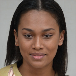 Joyful black young-adult female with medium  brown hair and brown eyes