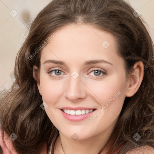 Joyful white young-adult female with medium  brown hair and green eyes