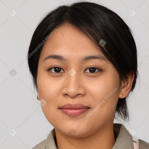 Joyful asian young-adult female with medium  black hair and brown eyes