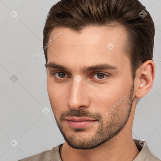 Neutral white young-adult male with short  brown hair and brown eyes