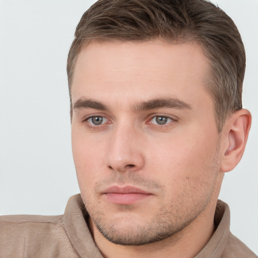 Neutral white young-adult male with short  brown hair and brown eyes