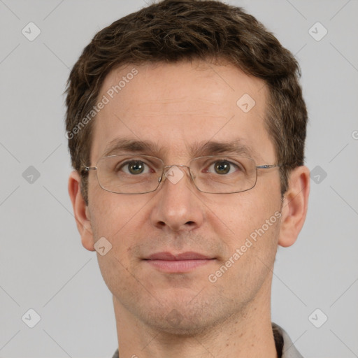 Joyful white adult male with short  brown hair and grey eyes