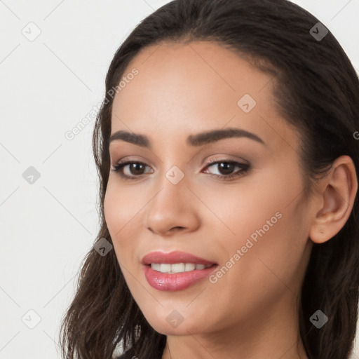 Joyful white young-adult female with long  black hair and brown eyes