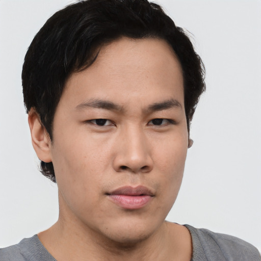 Neutral asian young-adult male with short  brown hair and brown eyes