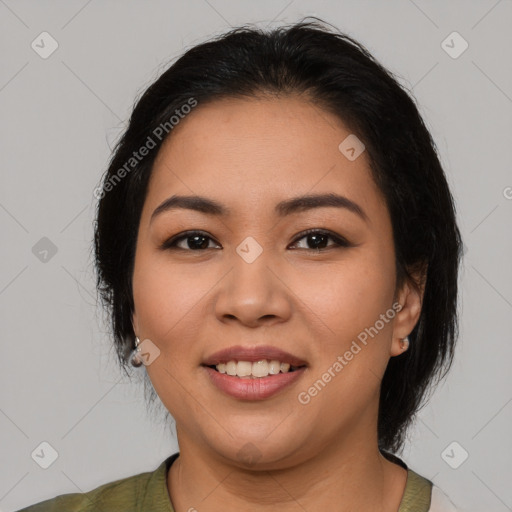 Joyful latino young-adult female with medium  black hair and brown eyes