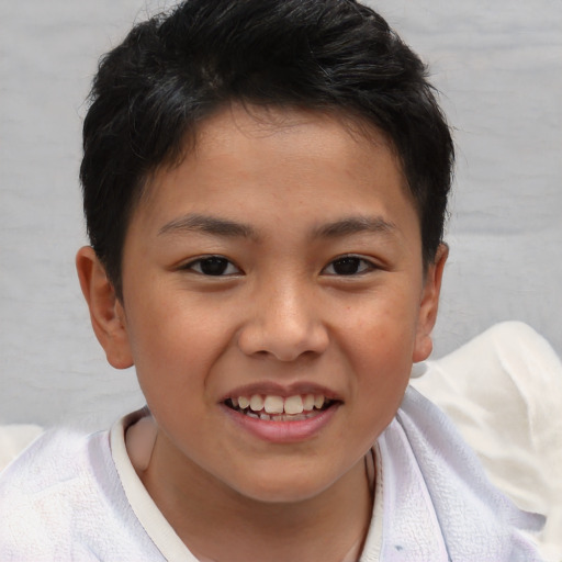 Joyful asian child female with short  brown hair and brown eyes