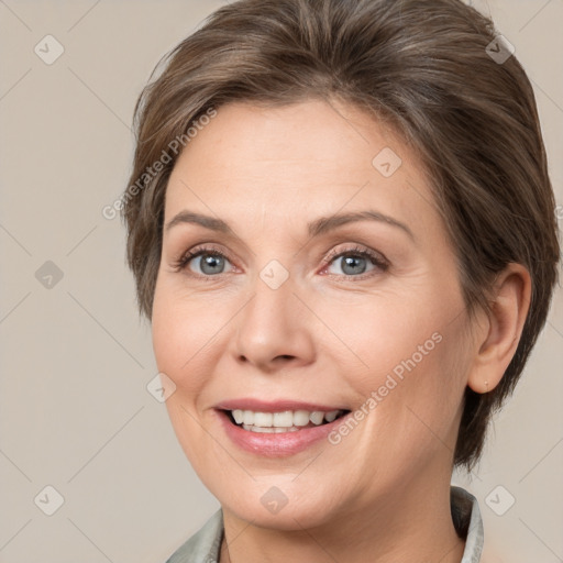 Joyful white adult female with medium  brown hair and grey eyes