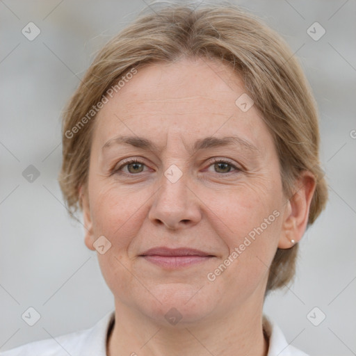 Joyful white adult female with medium  brown hair and grey eyes