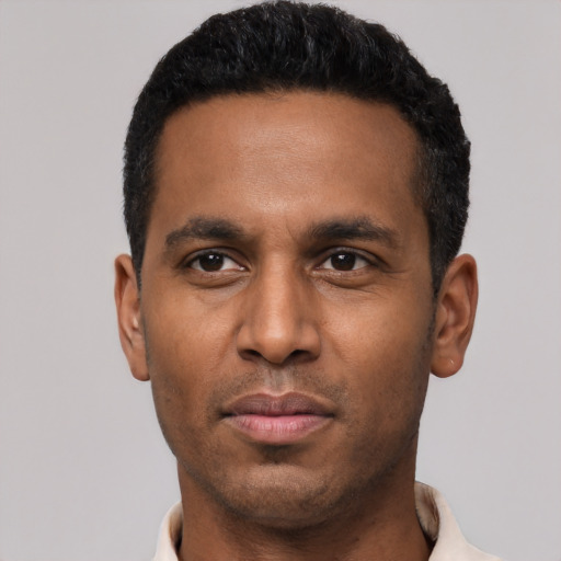 Neutral black young-adult male with short  black hair and brown eyes