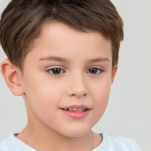 Joyful white child male with short  brown hair and brown eyes