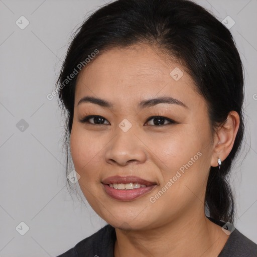 Joyful asian young-adult female with medium  black hair and brown eyes