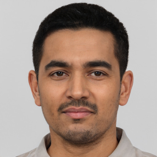 Neutral latino young-adult male with short  black hair and brown eyes