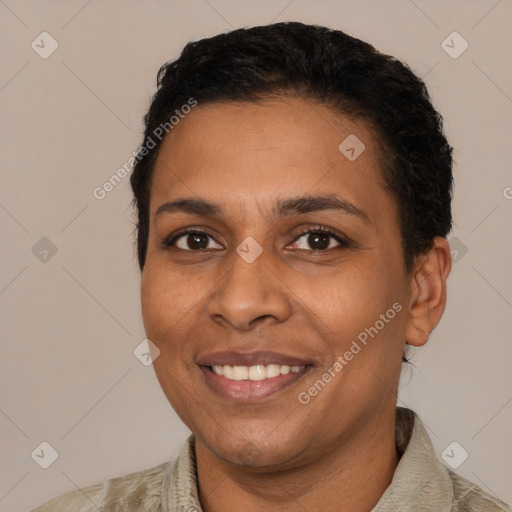 Joyful black young-adult female with short  brown hair and brown eyes