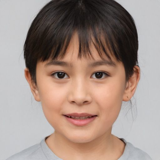 Joyful asian child female with medium  brown hair and brown eyes