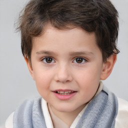 Joyful white child male with short  brown hair and brown eyes