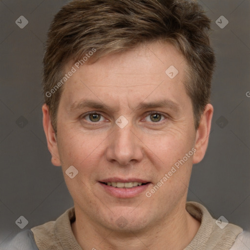 Joyful white adult male with short  brown hair and grey eyes