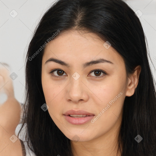 Joyful asian young-adult female with long  brown hair and brown eyes