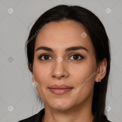 Joyful white young-adult female with long  brown hair and brown eyes