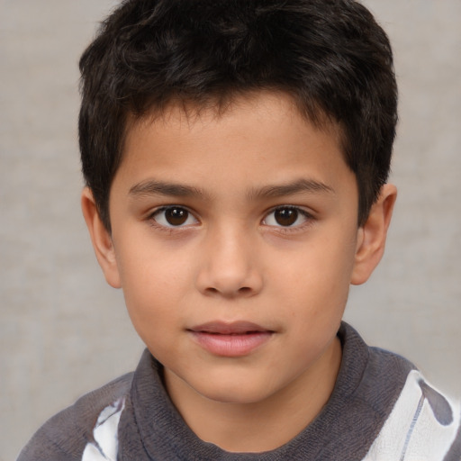 Joyful white child male with short  brown hair and brown eyes