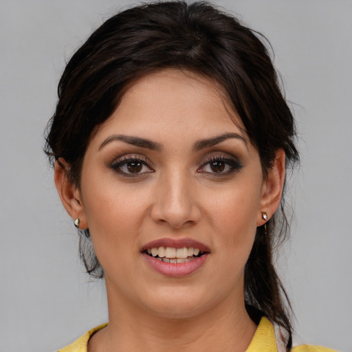 Joyful white young-adult female with medium  brown hair and brown eyes