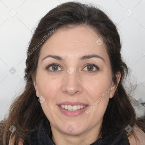 Joyful white adult female with long  brown hair and brown eyes