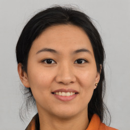 Joyful asian young-adult female with medium  brown hair and brown eyes