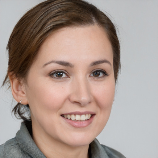 Joyful white young-adult female with medium  brown hair and brown eyes