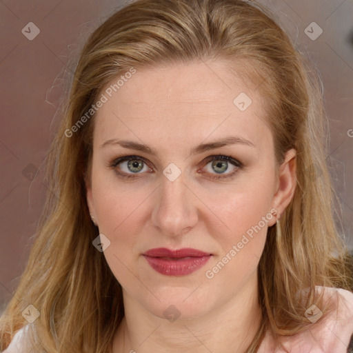 Joyful white young-adult female with long  brown hair and blue eyes