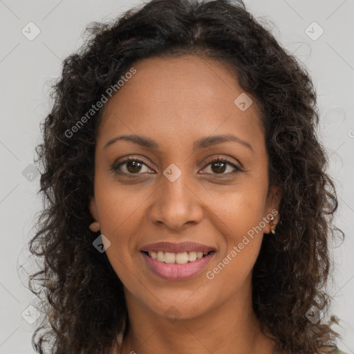 Joyful black young-adult female with long  brown hair and brown eyes