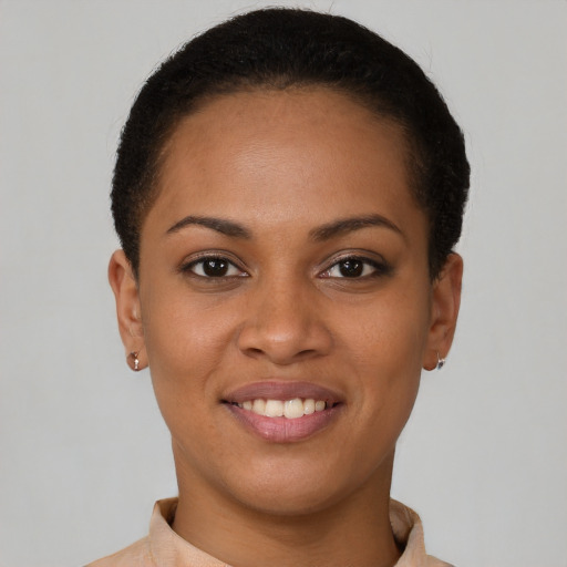 Joyful latino young-adult female with short  brown hair and brown eyes