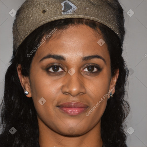 Joyful black young-adult female with long  brown hair and brown eyes