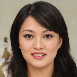 Joyful asian young-adult female with long  brown hair and brown eyes