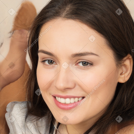 Joyful white young-adult female with long  brown hair and brown eyes