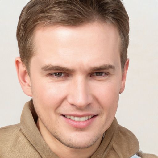 Joyful white young-adult male with short  brown hair and grey eyes