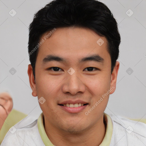 Joyful asian young-adult male with short  brown hair and brown eyes