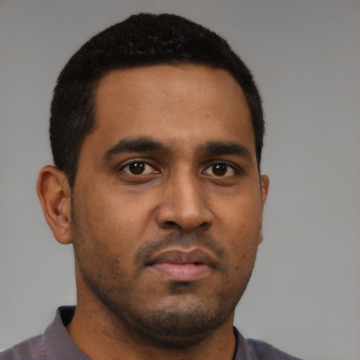 Neutral black young-adult male with short  black hair and brown eyes