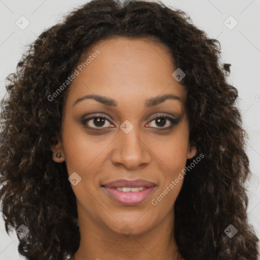 Joyful black young-adult female with long  brown hair and brown eyes