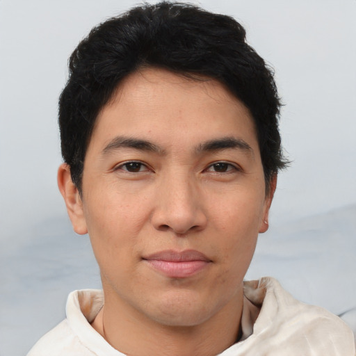 Joyful asian young-adult male with short  brown hair and brown eyes