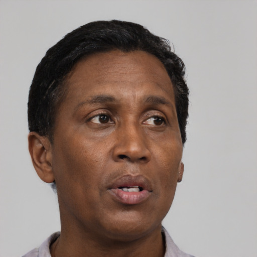 Neutral black adult male with short  black hair and brown eyes