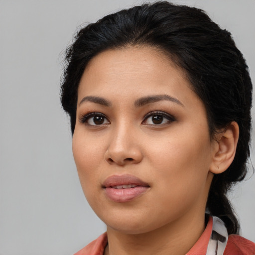 Joyful asian young-adult female with long  brown hair and brown eyes