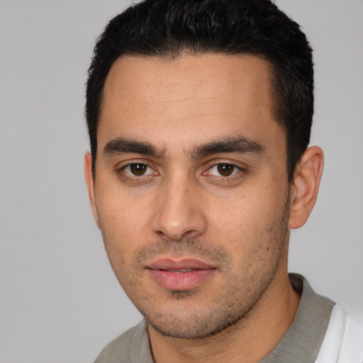 Neutral white young-adult male with short  black hair and brown eyes