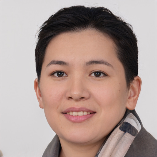 Joyful asian young-adult female with medium  brown hair and brown eyes