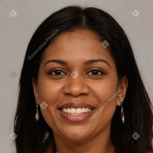 Joyful black young-adult female with long  brown hair and brown eyes