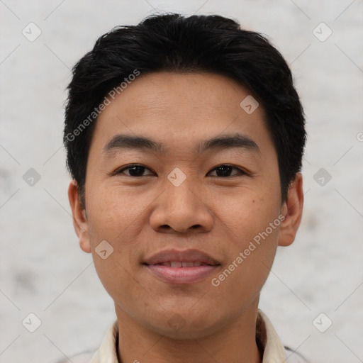 Joyful asian young-adult male with short  black hair and brown eyes