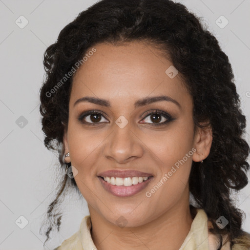 Joyful black young-adult female with long  brown hair and brown eyes