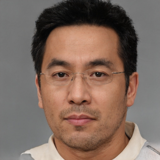 Neutral asian adult male with short  black hair and brown eyes