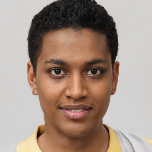 Joyful black young-adult male with short  black hair and brown eyes