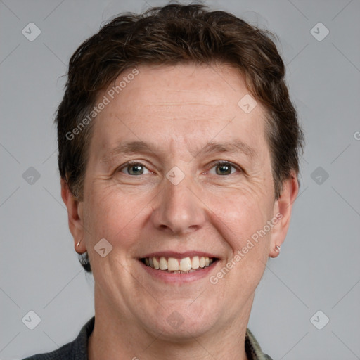 Joyful white adult male with short  brown hair and grey eyes