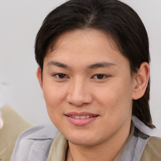 Joyful asian young-adult female with medium  brown hair and brown eyes
