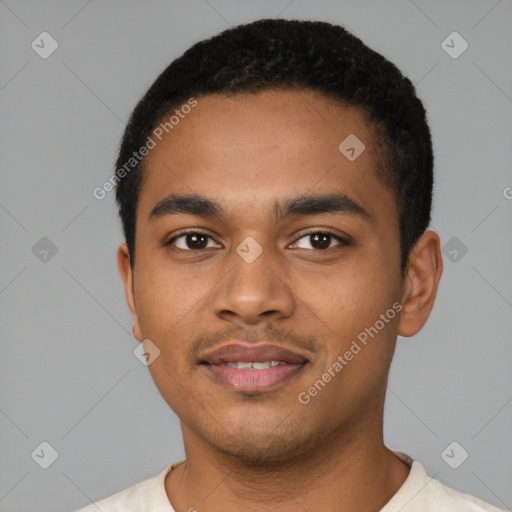 Joyful black young-adult male with short  black hair and brown eyes